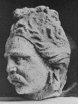 Head of Brahman with a novice lock of hair