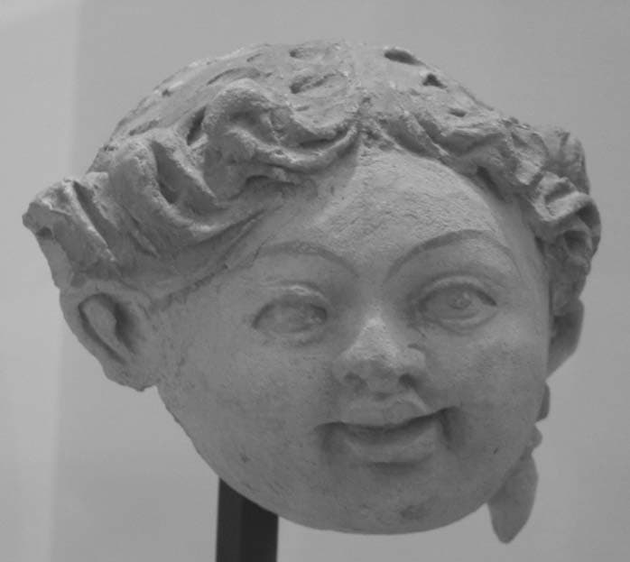 Figure in Stucco: Head of a young Donor, Tapa Kalān, Hadda